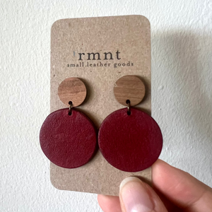 Open image in slideshow, Pair of Eames Echo Raspberry Jam leather earrings on a &#39;rmnt&#39; branded card against a white background
